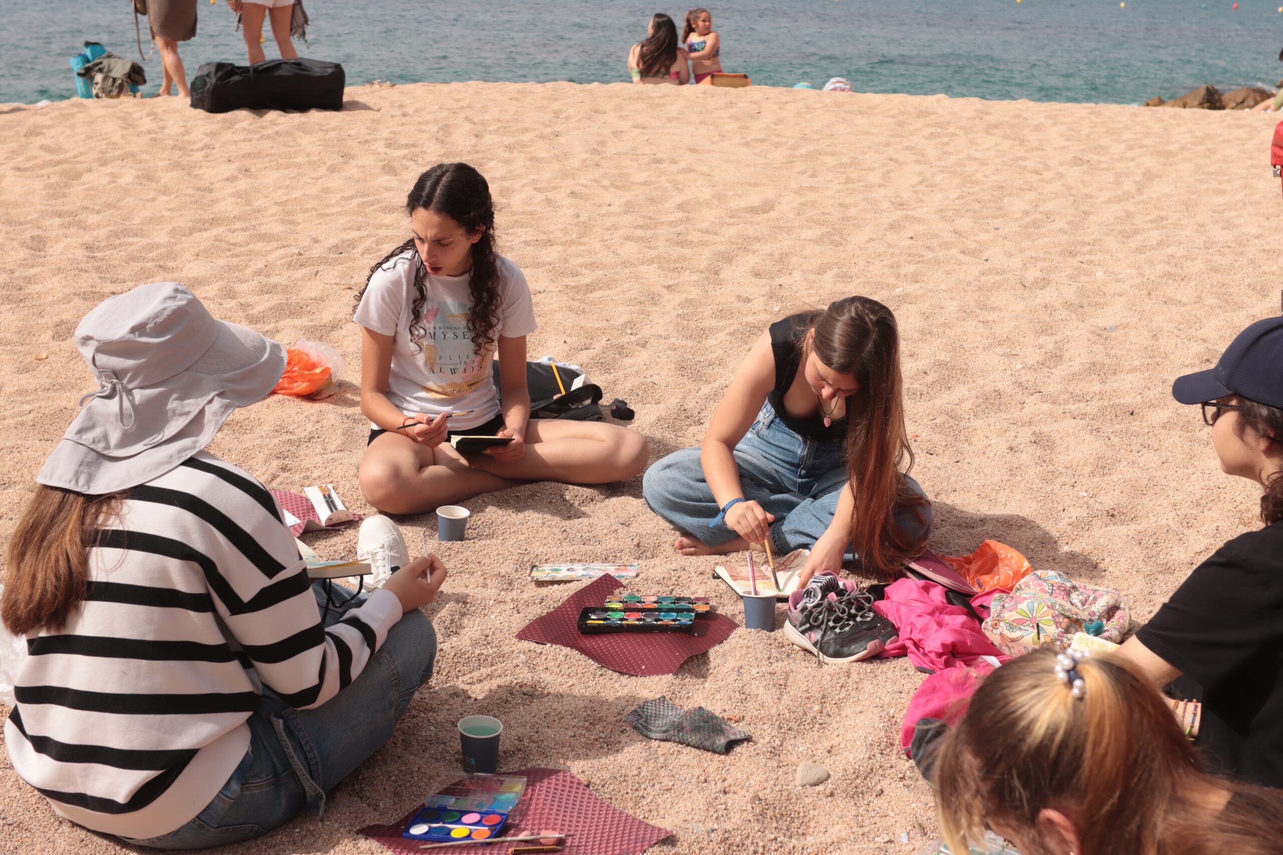Participants painting outdoors beside the Mediterranean, Beauty of the Costa Brava archive, May 2025.