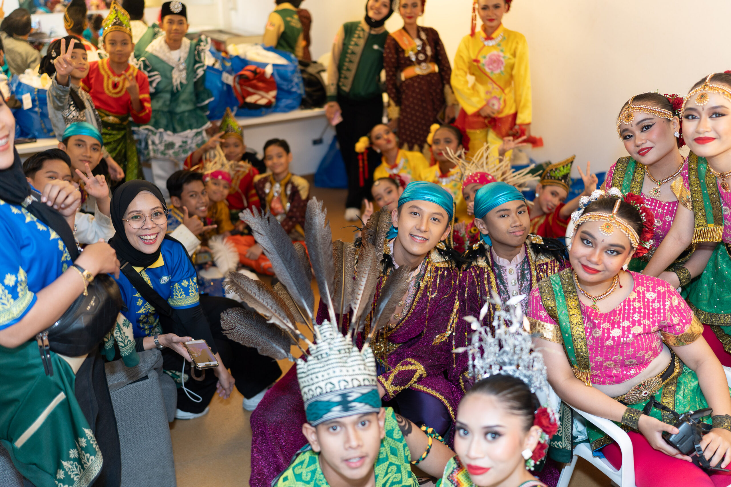 Dancers in colourful costumes backstage, International Dance Games shared contest archive, June 2025.