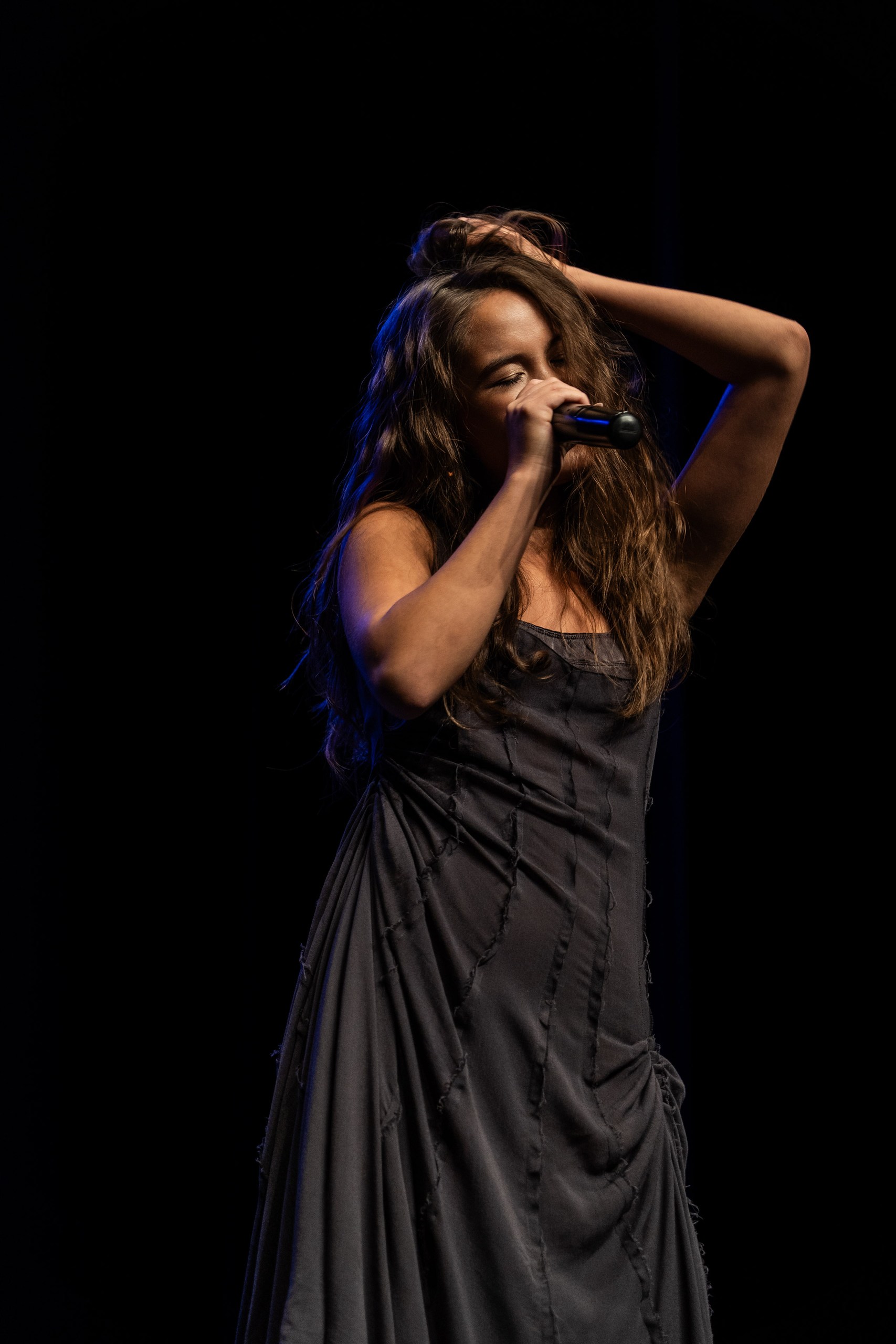 A solo vocalist performing at the Super Grand Prix competition, archive 2025.