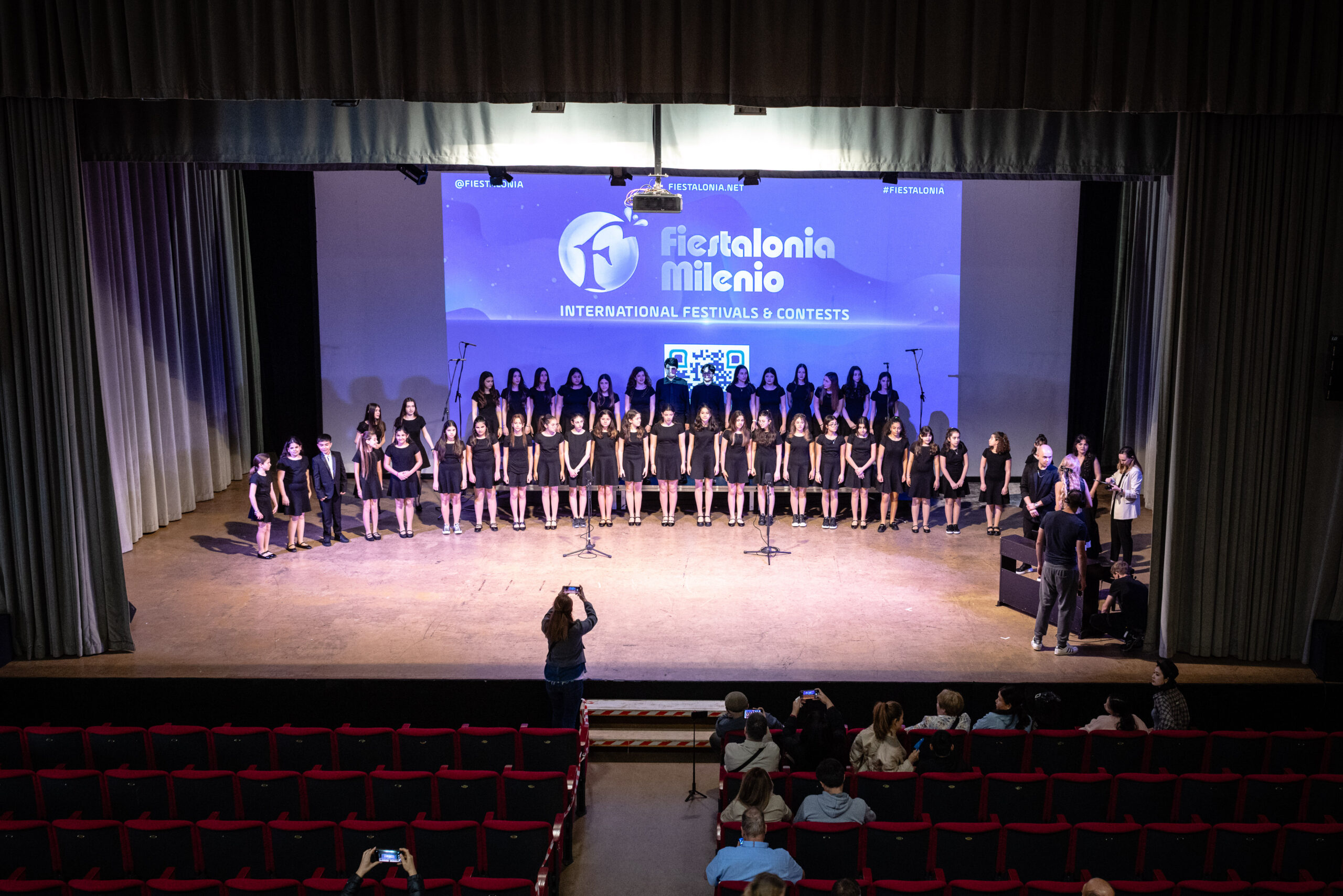 A choir performing on stage at World of Choirs, Rimini, archive 2025. Photo: Mattia Celli.